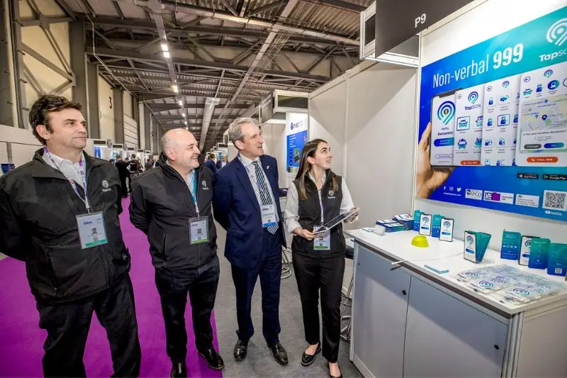 Visitors with the team at the TapSOS Non-verbal 999 exhibition stand
