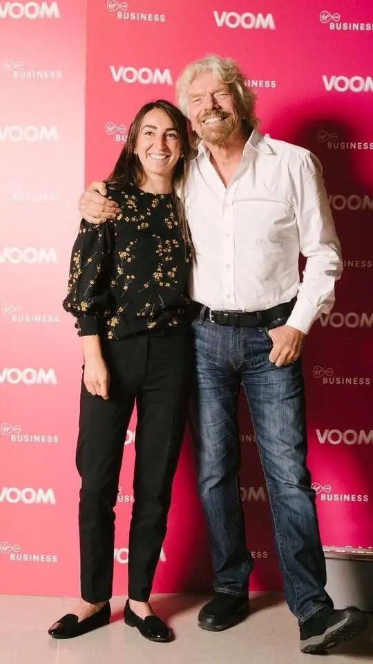 Two people on the VOOM event red carpet